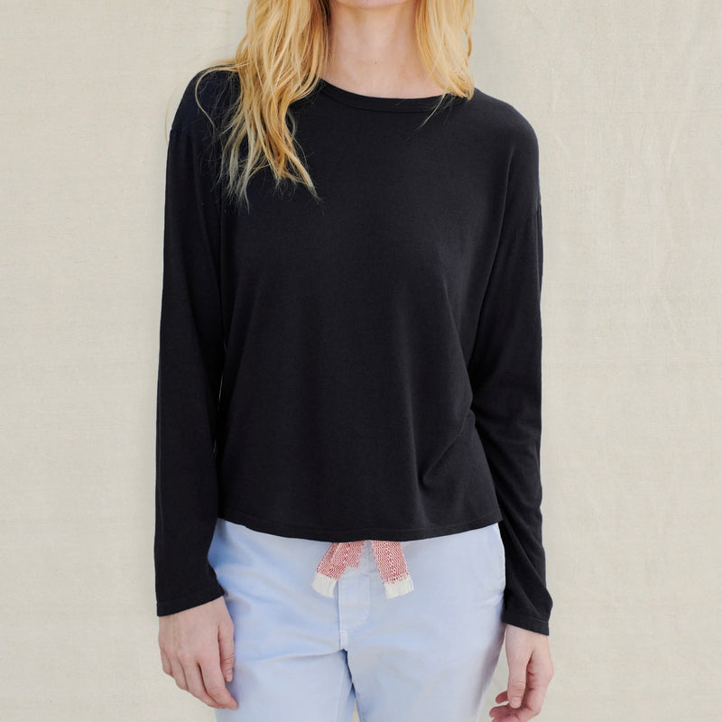 Sundry Long Sleeve Tee - model wearing long sleeved black t-shirt on a neutral background