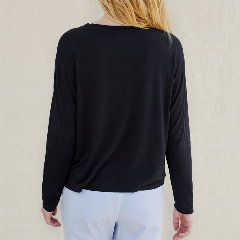 Sundry Long Sleeve Tee - model wearing long sleeved black t-shirt on a neutral background