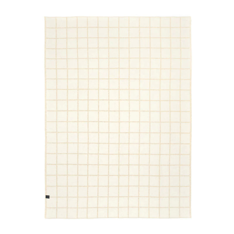 Grid-patterned blanket with beige lines on a white background