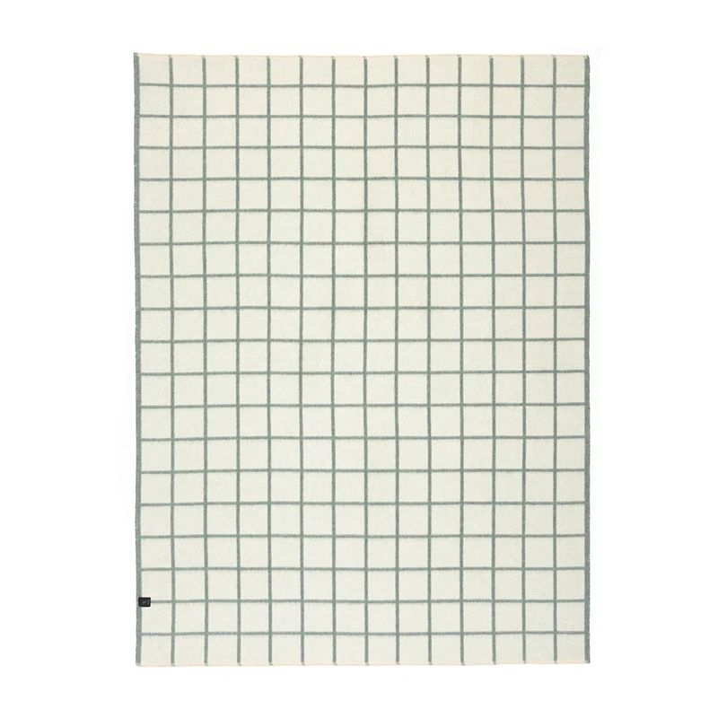 Grid-patterned blanket with black lines on a white background