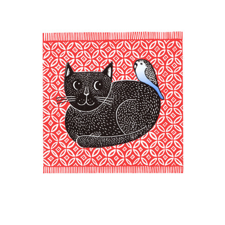 a black cat on a red rug with a bird on its back