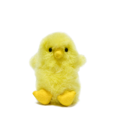 Plush yellow chick toy on a white background