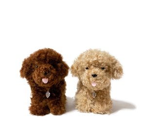 Two stuffed toy dogs, one brown and one beige, standing side by side on a white background.