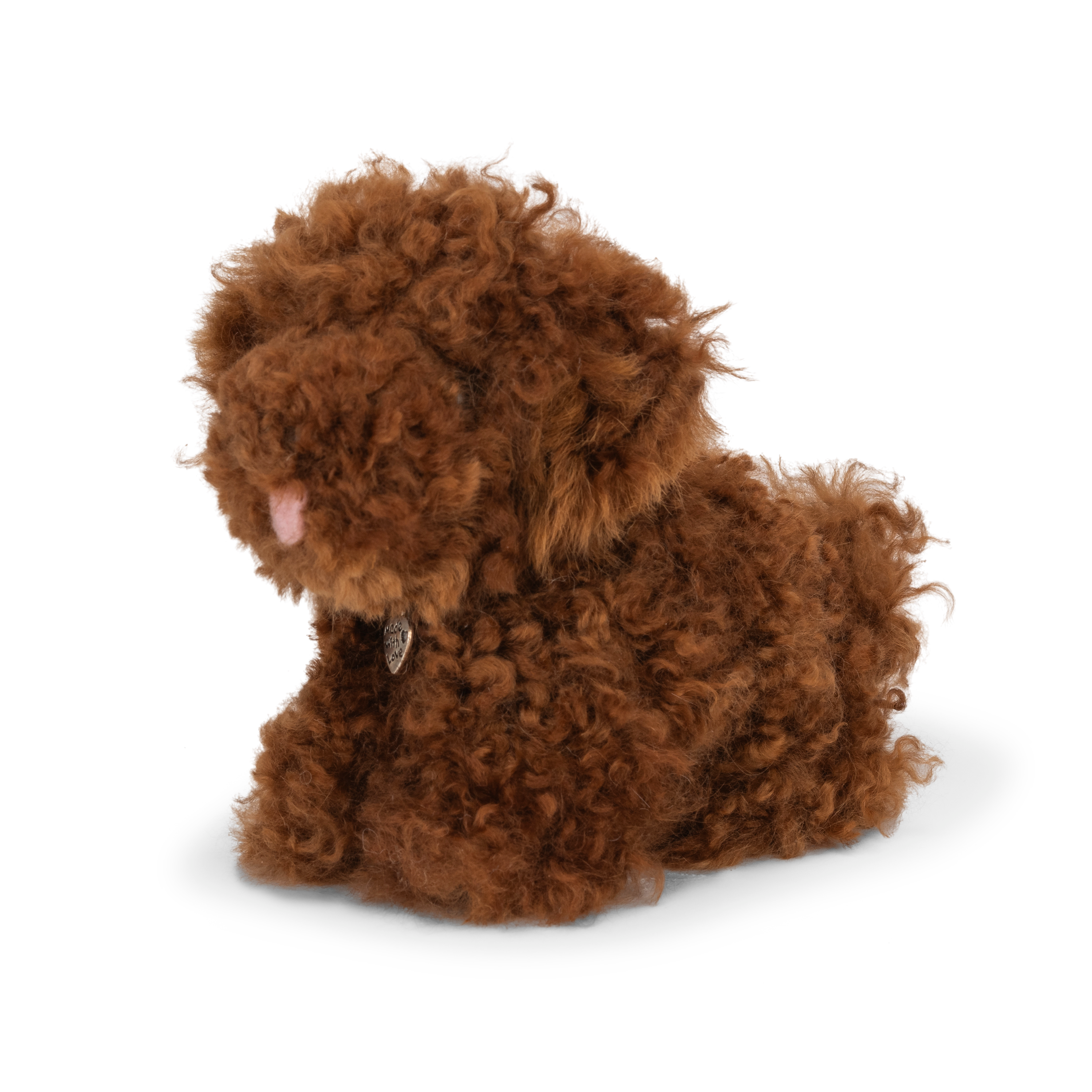 Brown plush dog toy on a white background