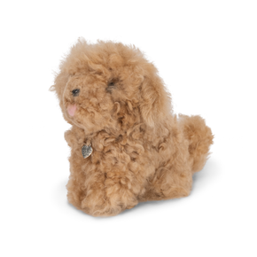 Plush toy resembling a dog with curly fur on a white background