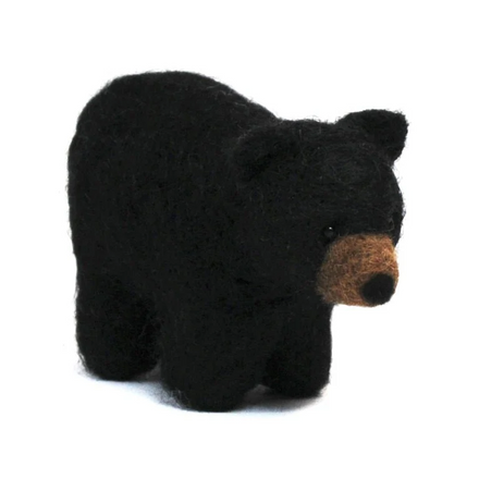 Black bear felted toy on a white background