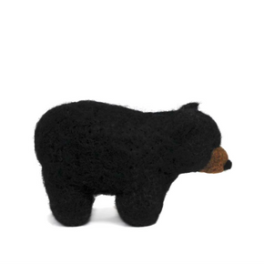 Black bear-shaped toy on a white background