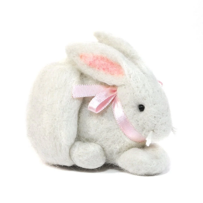 Plush felted bunny toy with a pink bow on a white background