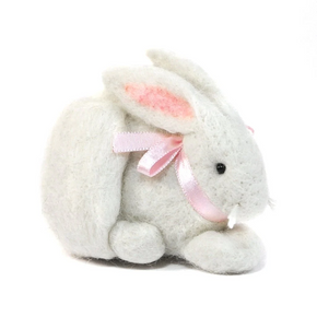 Plush felted bunny toy with a pink bow on a white background