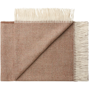 Folded shawl with geometric pattern and white fringe on a white background