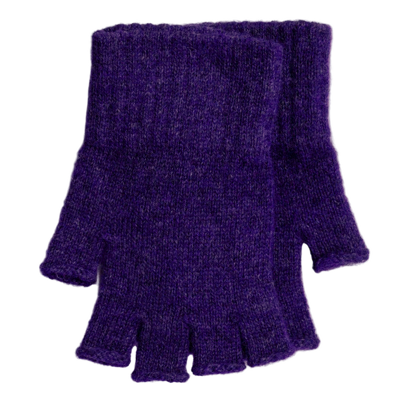 Purple knitted fingerless gloves on a white wooden surface