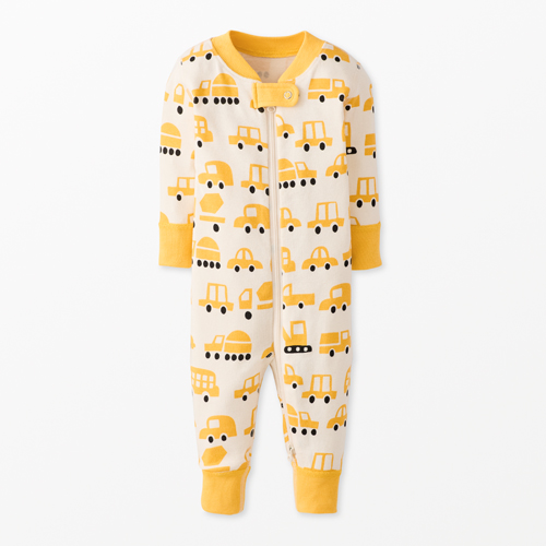 Babies zip onesie with a yellow vehicle pattern on a neutral background.