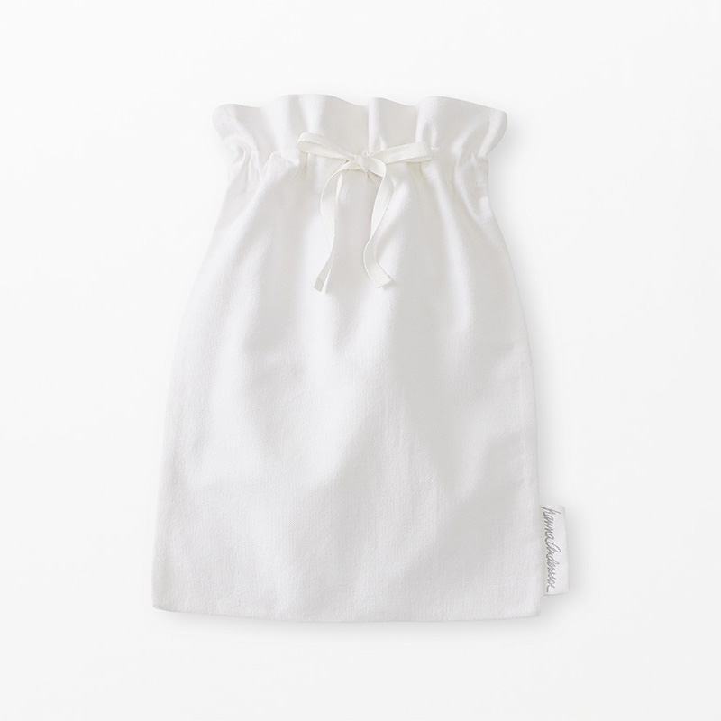 White drawstring bag on a light beige background