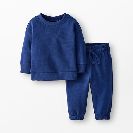 Blue children's sweatshirt and pants set on a white background