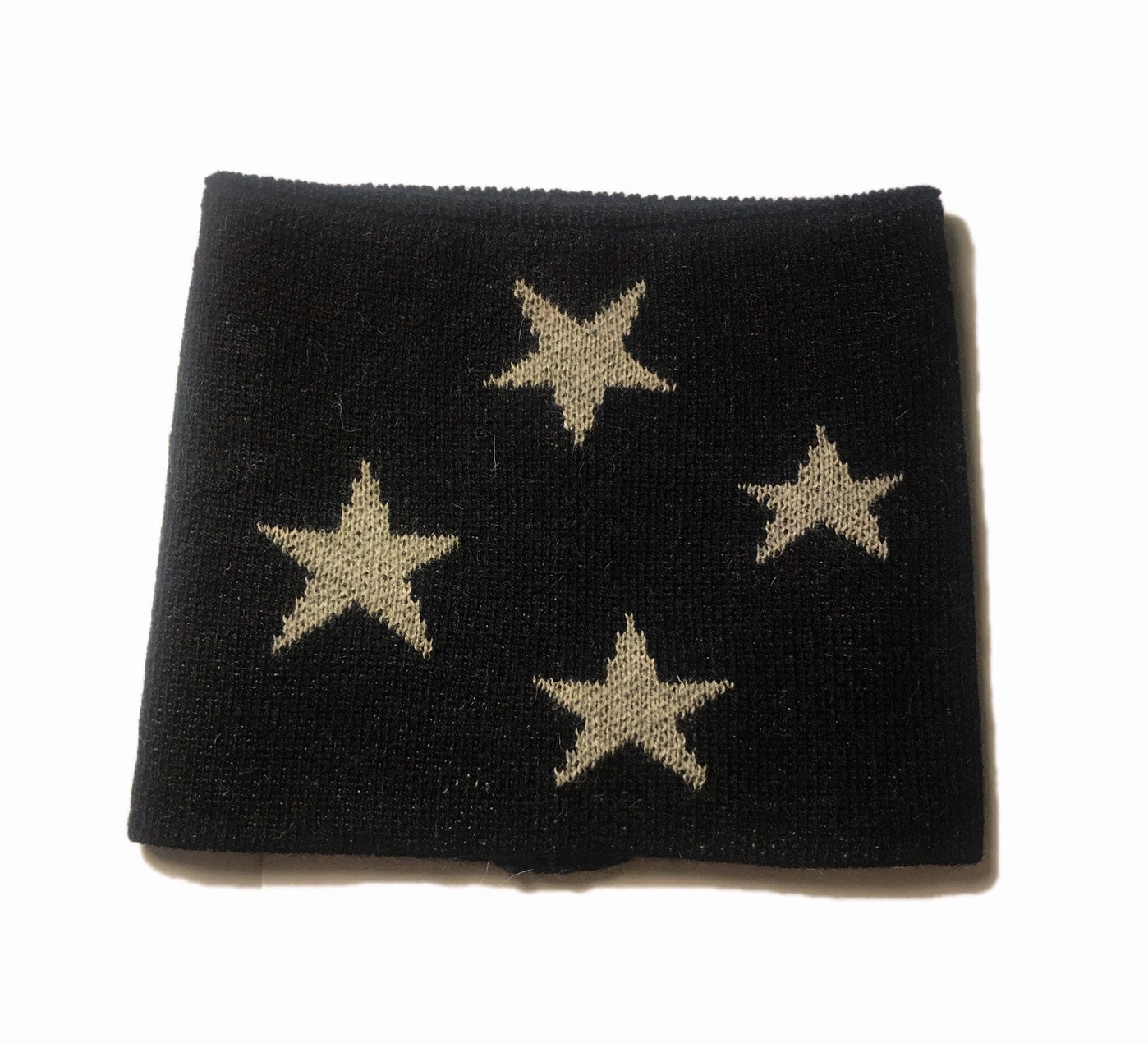 Black neck warmer with grey stars on a white background