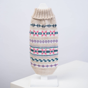 White dog sweater with geometric patten on a white background