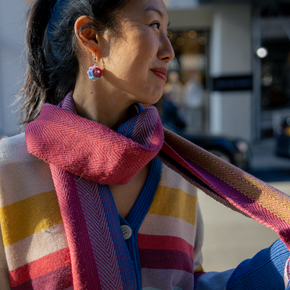 Woman wearing a colorful scarf in an urban setting