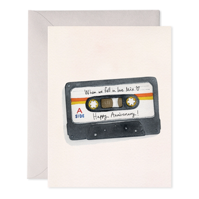 Greeting card with a cassette tape design and 'Happy Anniversary!' text on a beige background.