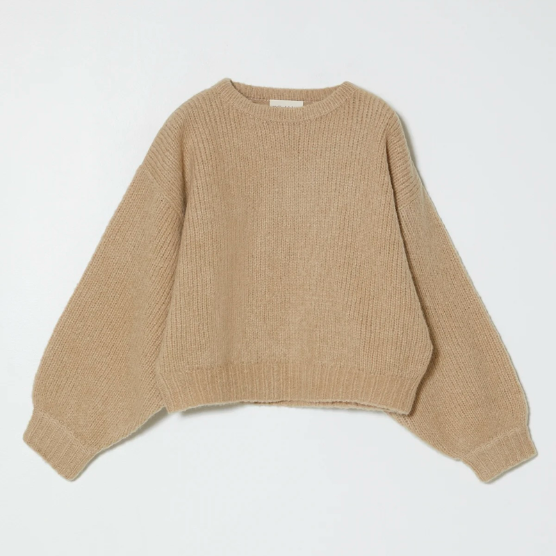 Beige knit sweater on a white background