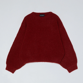 Red knit sweater on a white background