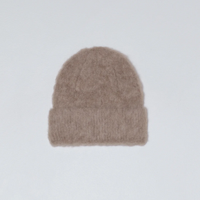 Beige knit beanie on a light gray background