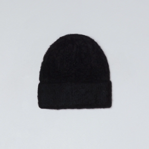 Black knit beanie on a light gray background