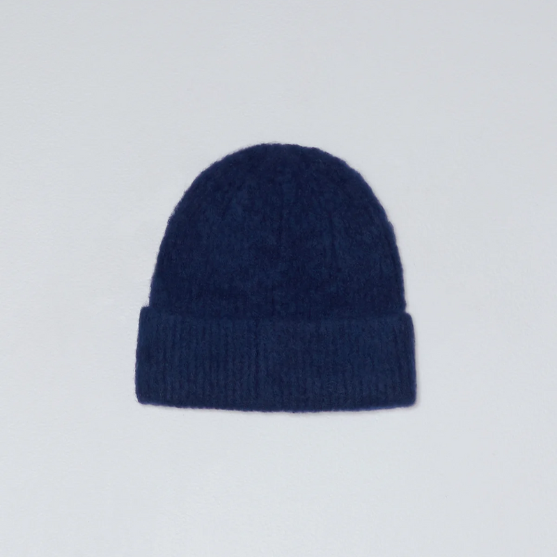 Navy blue beanie on a light gray background
