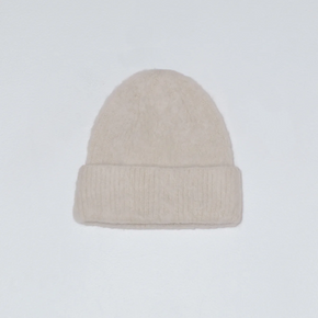 White knit beanie on a white background