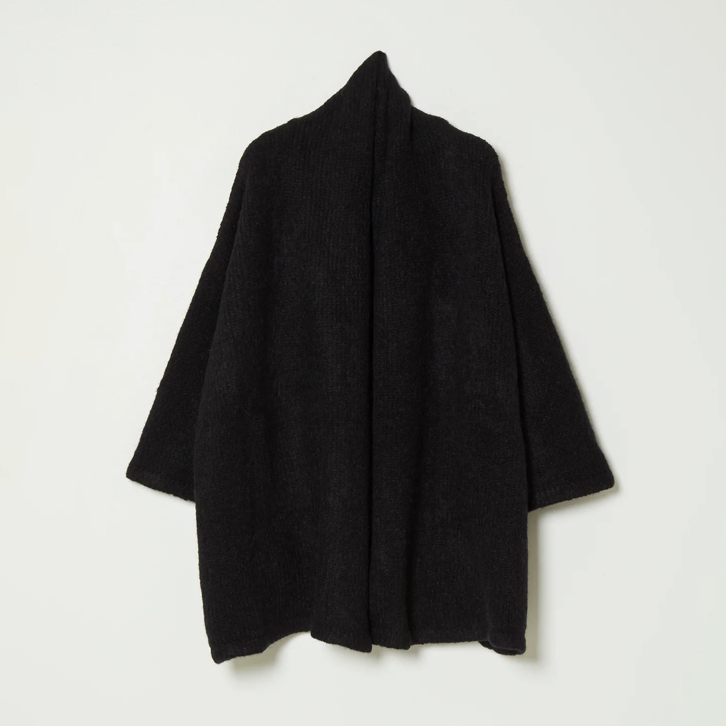 Black knit wrap coat on white background