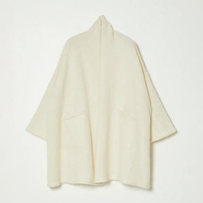 White knit wrap coat on white background