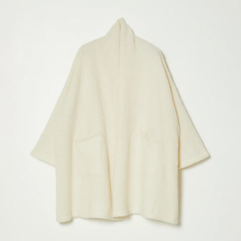 White knit wrap coat on white background