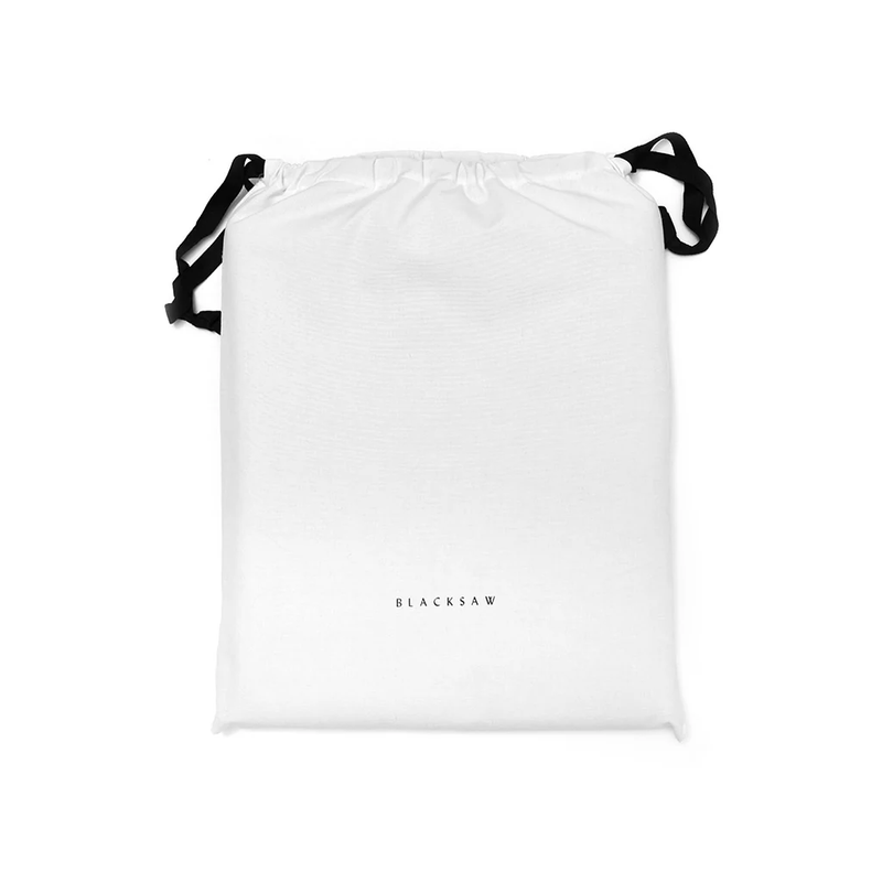 White drawstring bag with black straps on a white background, featuring the brand 'BLACKSAW'.