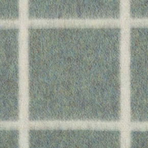 Textured blanket with a grid pattern in shades of green and white
