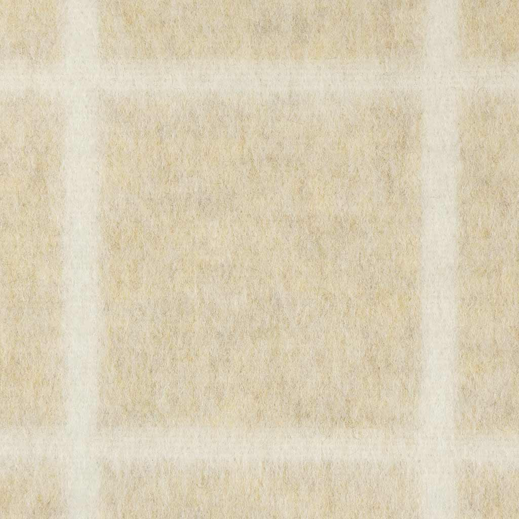 Close-up of a beige and white checkered blanket pattern