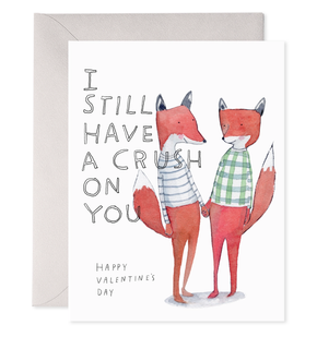 Valentine's Day card with two foxes holding hands and text 'I still have a crush on you'.