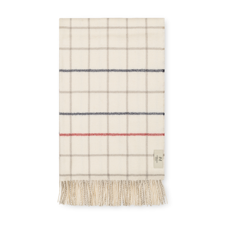 Plaid blanket with fringes on a white background