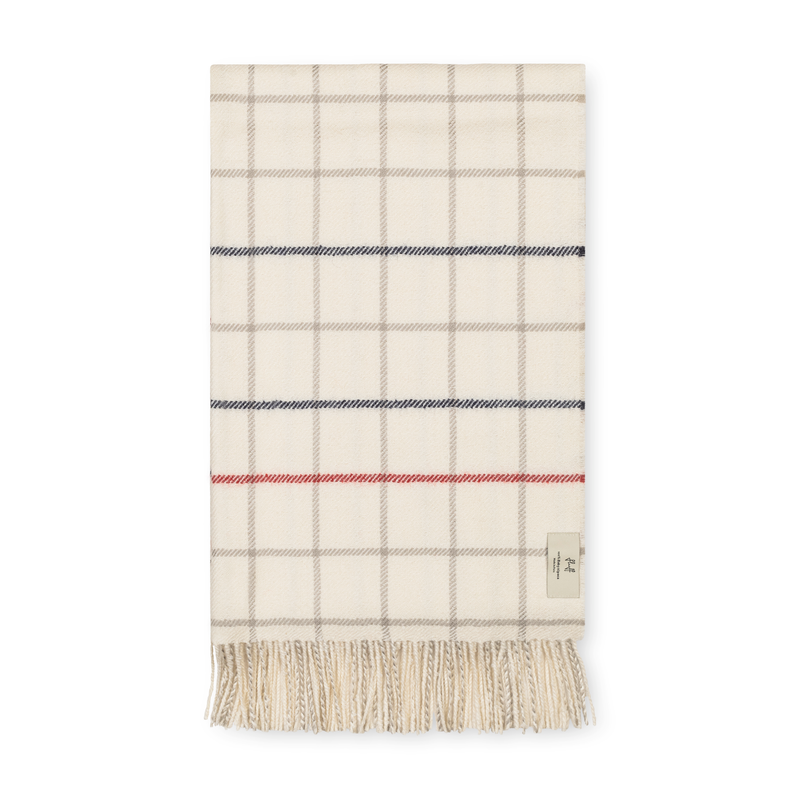 Plaid blanket with fringes on a white background