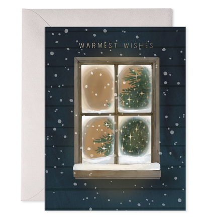 Greeting card with a window view of a Christmas tree and 'Warmest Wishes' text on a dark blue background.