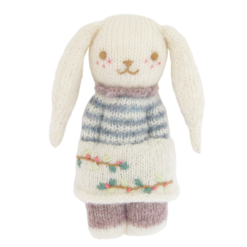 Bunny shaped stuffed animal on a white background