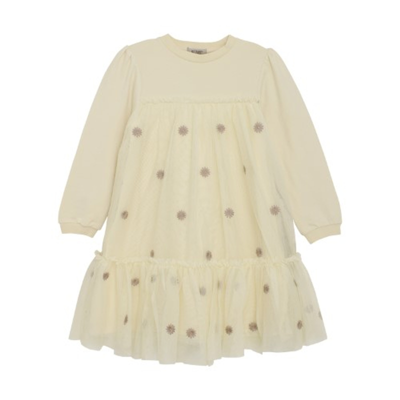 Cream-colored dress with small patterns on a white background