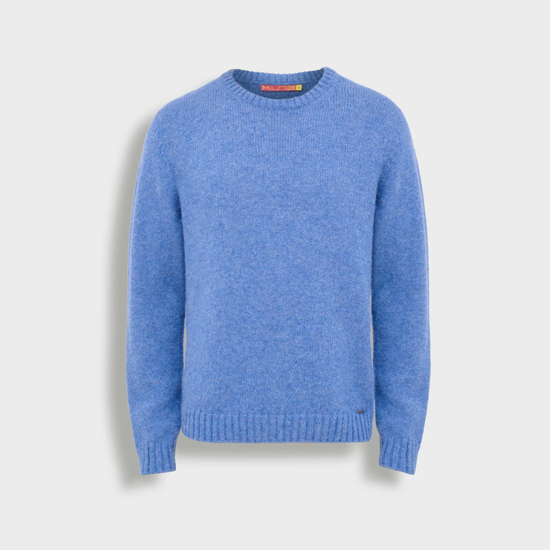 Blue sweater on a light gray background