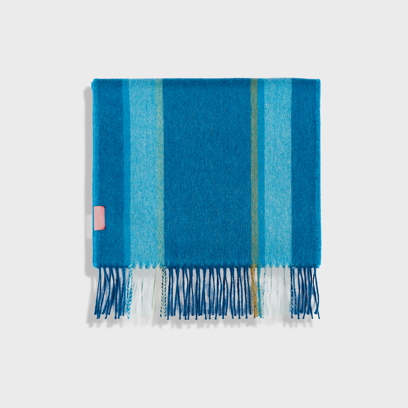 Blue striped scarf with fringes on a white background