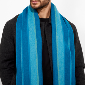 Person wearing a blue striped scarf on a white background