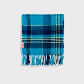 Blue plaid blanket with fringes on a white background