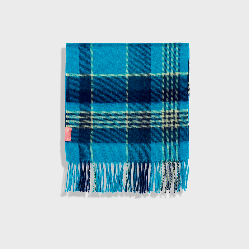 Blue plaid blanket with fringes on a white background