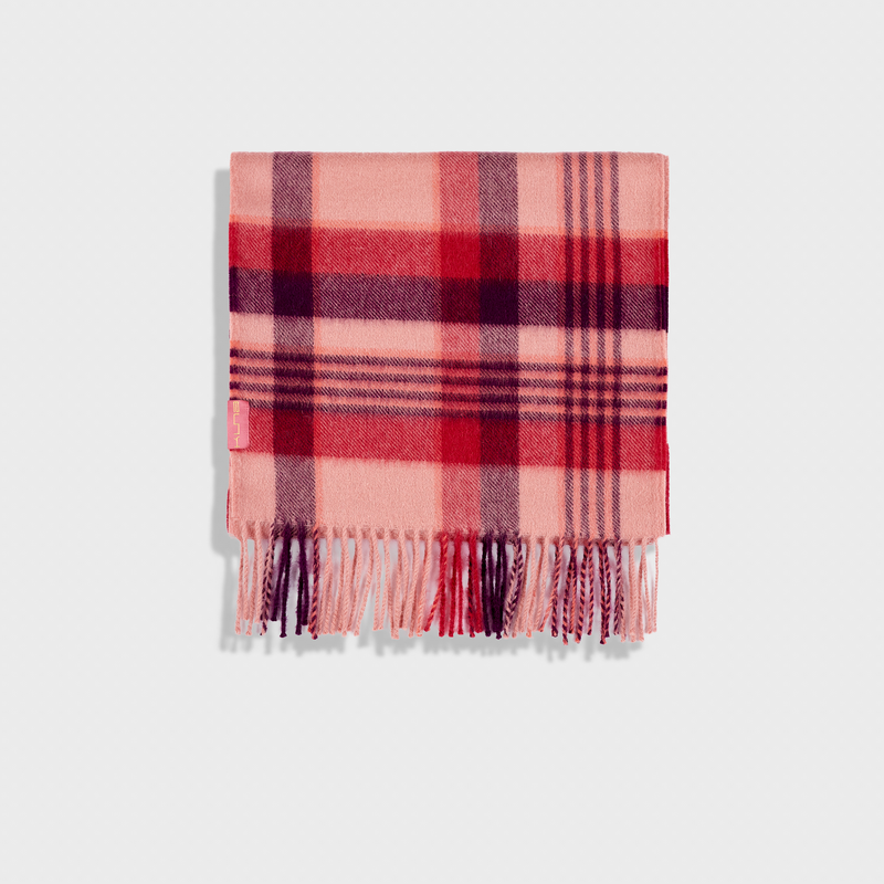 Plaid blanket with pink and purple colors on a white background