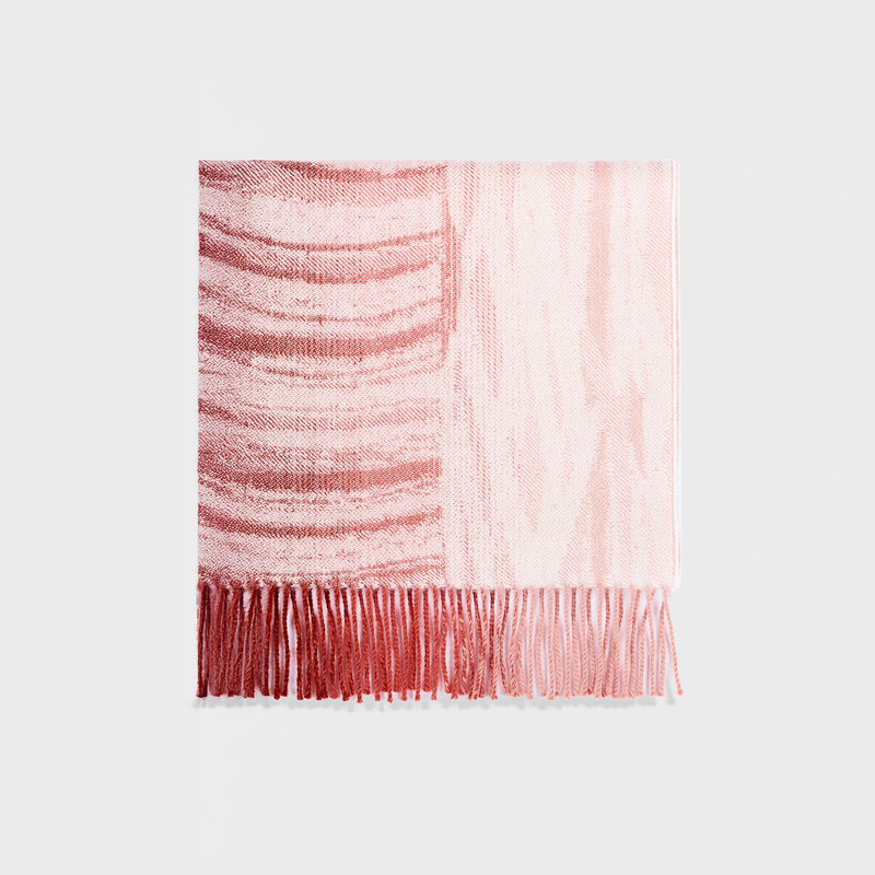 Pink striped scarf with fringe on a white background