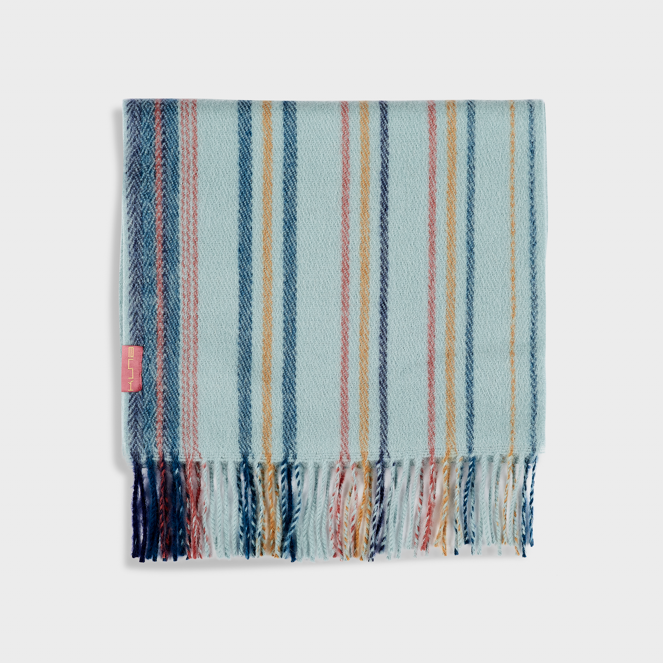 Striped scarf with blue, pink, and white colors on a light gray background