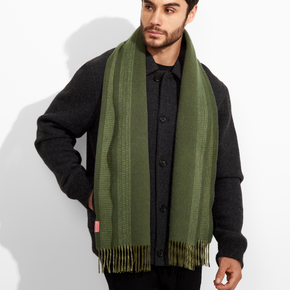 Man wearing a green scarf on a white background