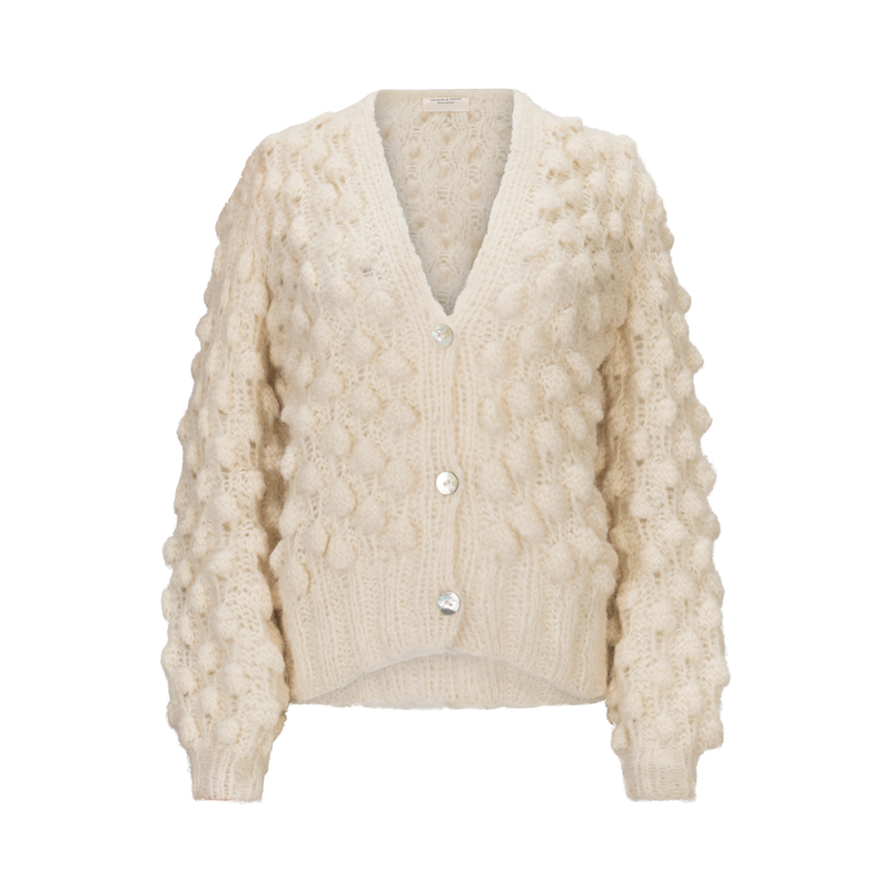 Cream knitted cardigan on a white background